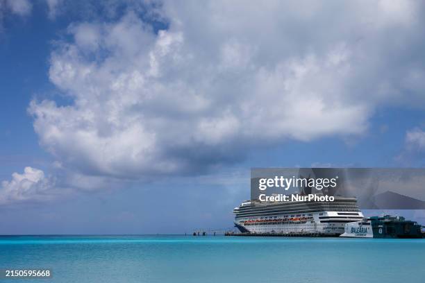 View of Carnival Freedom cruise ship and Balearia Caribbean ferry in Bimini, Bahamas on May 1, 2024.