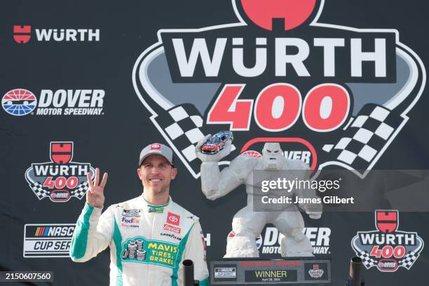 Denny Hamlin, driver of the Mavis Tire Toyota, celebrates in victory lane after winning the NASCAR Cup Series Würth 400 at Dover International...