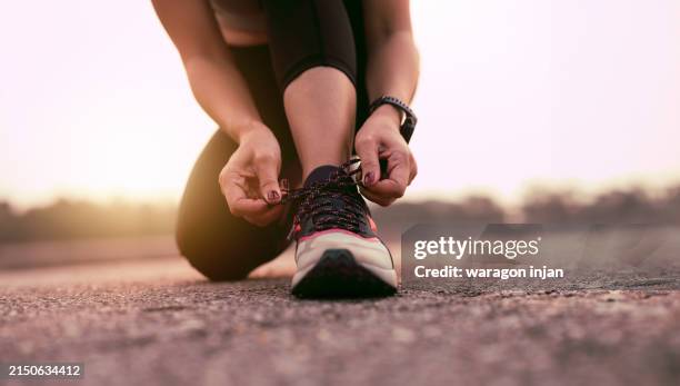 running shoes runner woman - tying shoelace stock pictures, royalty-free photos & images