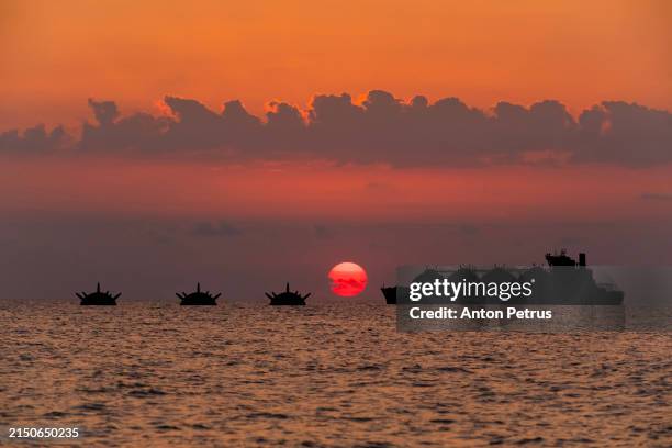 cargo ship and naval mines - black sea stock pictures, royalty-free photos & images