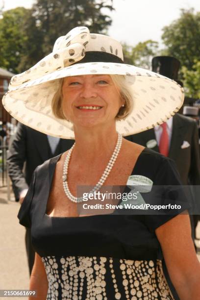 Journalist Kate Adie attends the second day of Royal Ascot 2007, she wears a black dress with pearl embellishments and a wide brimmed white hat with...
