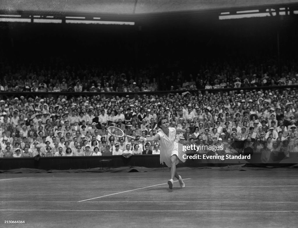 Dorpthy Knode Tennis player Doris Hart stretches to makes a forehand volley during ...