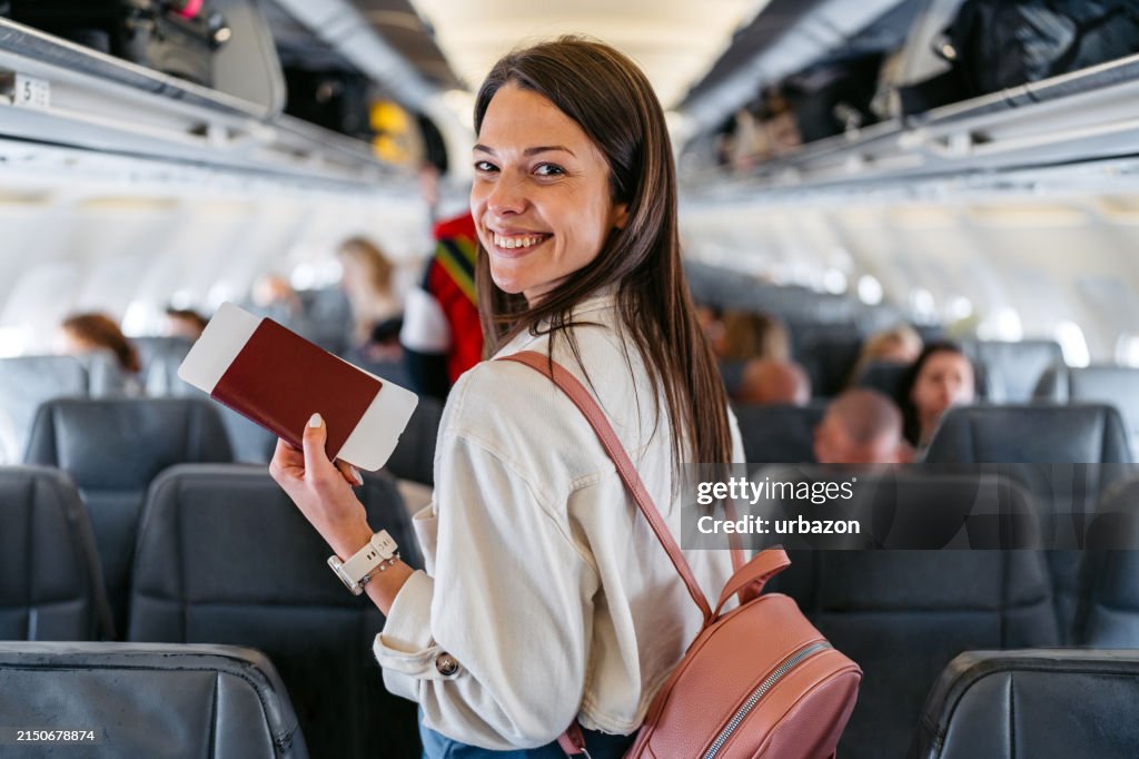 Young Woman Boarding An Airplane