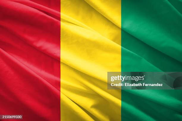 flag of guinea - guinea flag stock pictures, royalty-free photos & images
