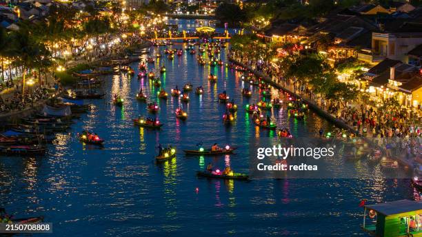 drone view lantern festival in ancient town hoi an at night, quang nam province, vietnam. - hoi an stockfoto's en -beelden