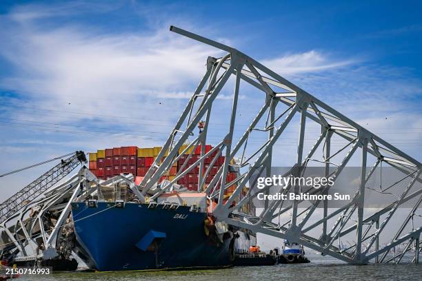 Salvage efforts continue as workers make preparations to remove the wreckage of the Francis Scott Key Bridge from the container ship Dali five weeks...
