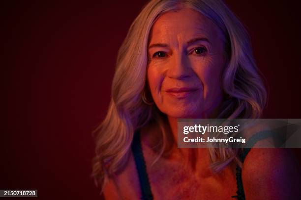 studio headshot of longhaired senior in bra - grey hair stock pictures, royalty-free photos & images