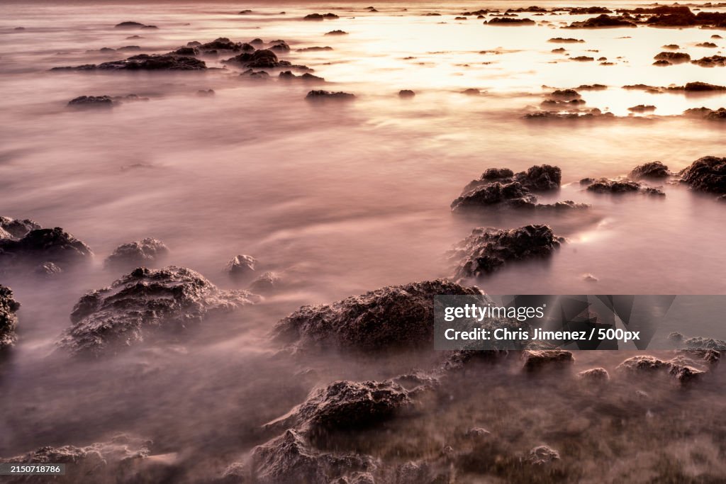 Scenic view of sea against sky at sunset