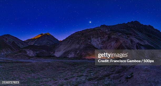 scenic view of mountains against sky at night - francisco gamboa stock pictures, royalty-free photos & images