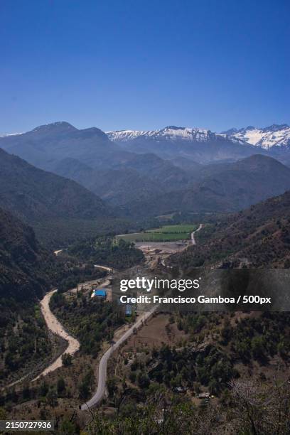 high angle view of road amidst mountains against clear blue sky - francisco gamboa stock pictures, royalty-free photos & images