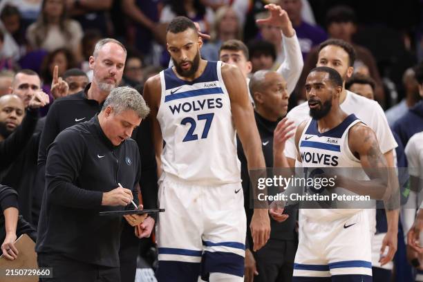 Assistant coach MicahNori of the Minnesota Timberwolves talks with Rudy Gobert and Mike Conley during the second half of game four of the Western...