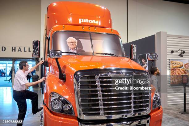 An attendee interacts with an exhibit during a shareholders shopping day ahead of the Berkshire Hathaway annual shareholders meeting in Omaha,...
