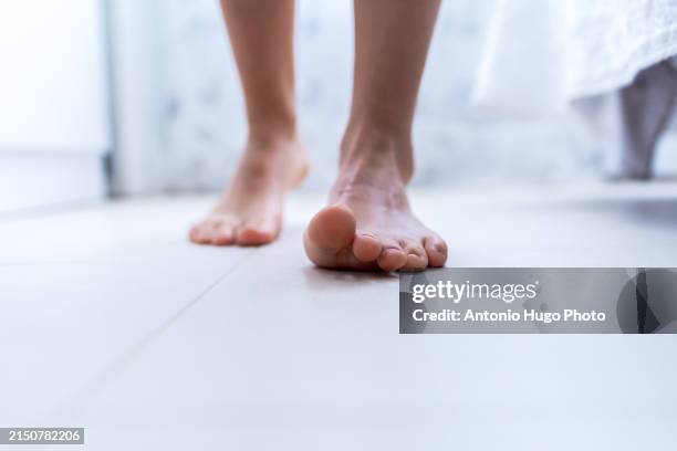 close-up of unshod feet walking on a white ground - foot ligaments stock pictures, royalty-free photos & images