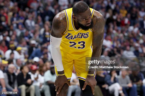 LeBron James of the Los Angeles Lakers gathers himself after taking a hard hit while playing the Denver Nuggets in the third quarter during game five...