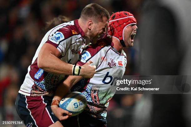 Harry Wilson of the Reds celebrates scoring a try during the round 11 Super Rugby Pacific match between the Crusaders and Queensland Reds at Apollo...