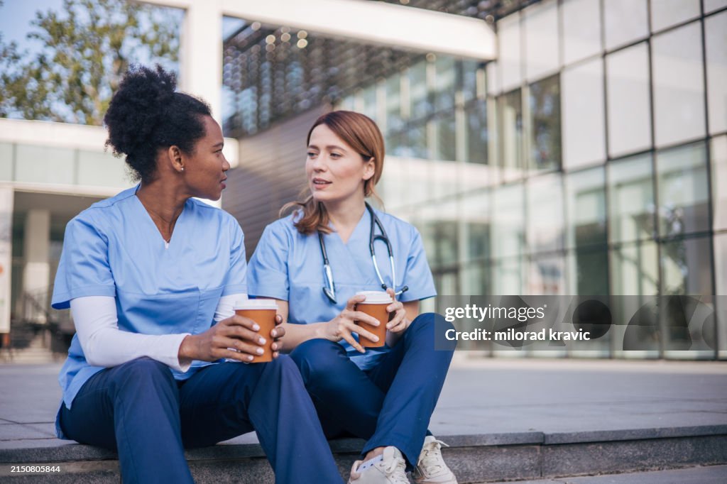 A picture of two female doctors on a coffee break.