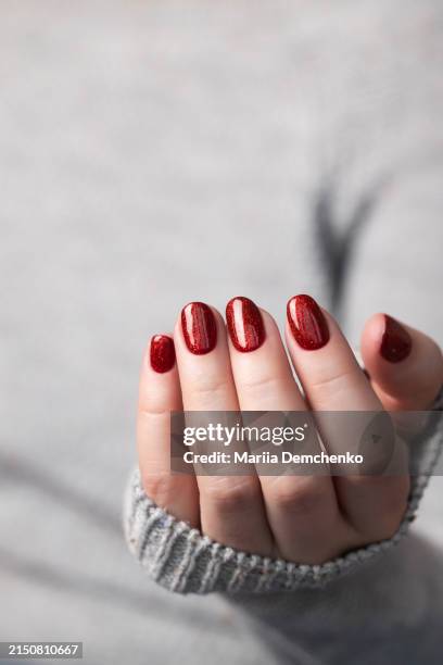 woman with red glitter gel fingernails - red enamel stock pictures, royalty-free photos & images