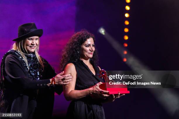 Syrian actress Hala Omran receives her award for the best female interpretation for her role in the Kuwaiti screenplay Mute during Closing ceremony...