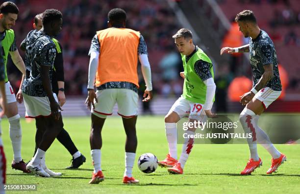 Arsenal's Belgian midfielder Leandro Trossard warms up ahead of the English Premier League football match between Arsenal and Bournemouth at the...