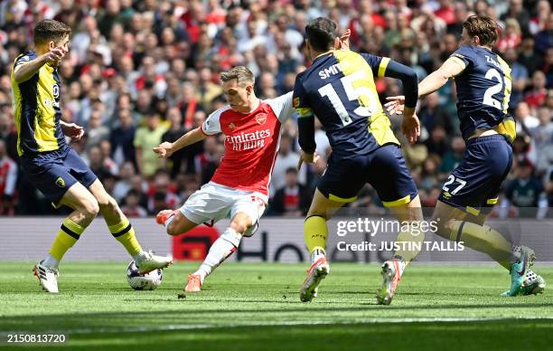 Arsenal's Belgian midfielder Leandro Trossard shoots but fails to score during the English Premier League football match between Arsenal and...