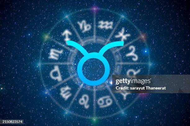 taurus astrology and horoscope predictions aries symbol on stars in the universe background light - taureau photos et images de collection