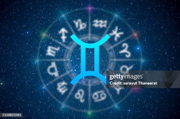 gemini astrology and horoscope predictions aries symbol on stars in the universe background light - tweeling stockfoto's en -beelden