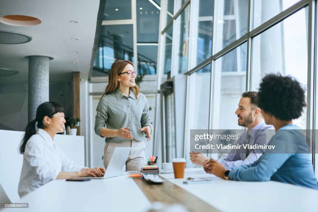 Vibrant office meeting with the animated speaker