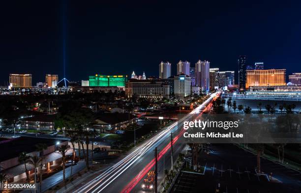 night trails and las vegas strip - mgm grand ariel view stock pictures, royalty-free photos & images