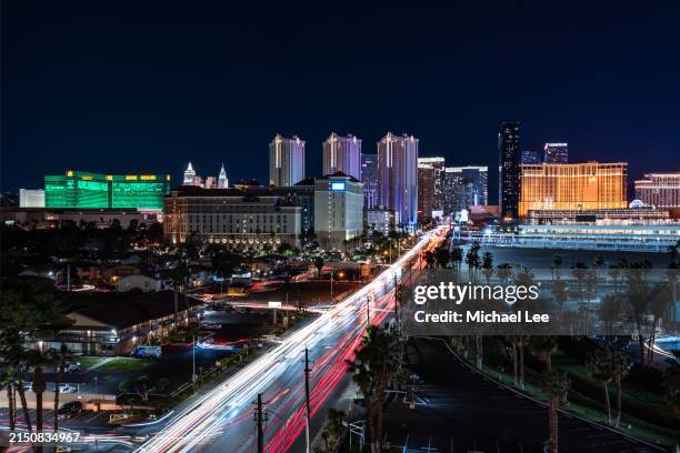 night trails and las vegas strip - mgm grand ariel view stock pictures, royalty-free photos & images