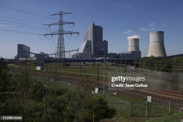An electricity pylon stand next to the Schwarze Pumpe coal-fired power station on April 30, 2024 in Schwarze Pumpe, Germany. LEAG, the energy company...