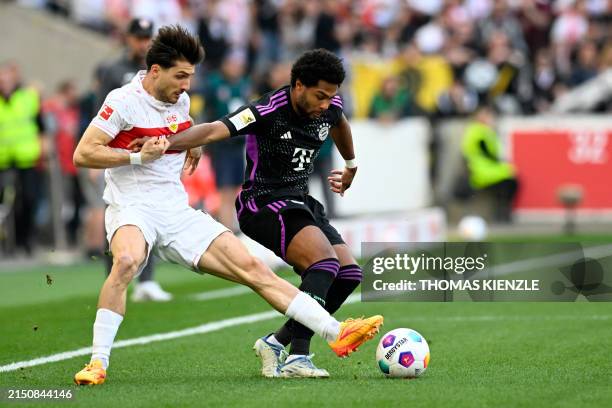 Stuttgart's Swiss defender Leonidas Stergiou and Bayern Munich's German forward Serge Gnabry vie for the ball during the German first division...