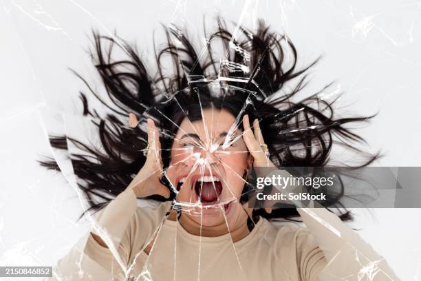 breaking the mirror with a scream - woman distorted mirror stock pictures, royalty-free photos & images
