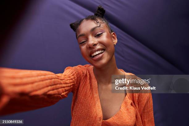 portrait of smiling teenage girl taking selfie - selfie stock pictures, royalty-free photos & images