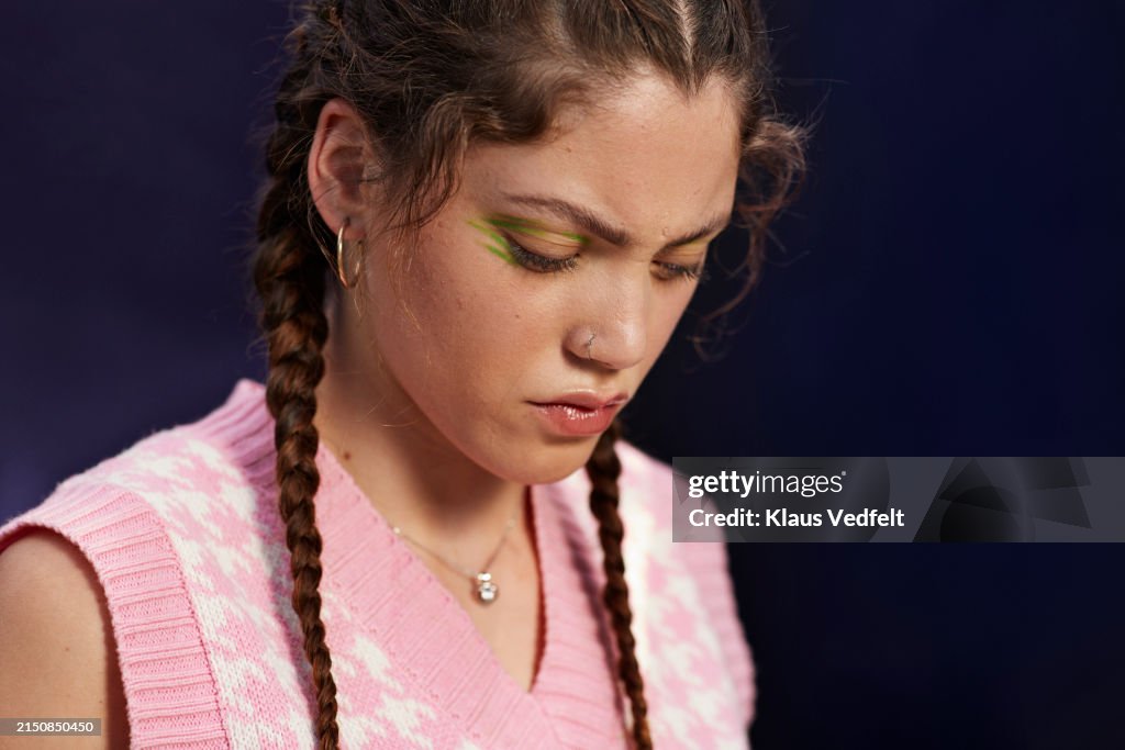 Close-up of young woman with eye make-up