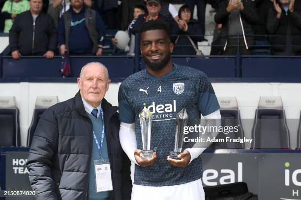 Tony Brown presents Cedric Kipre of West Bromwich Albion Players Player and Fans Player of the year during the Sky Bet Championship match between...