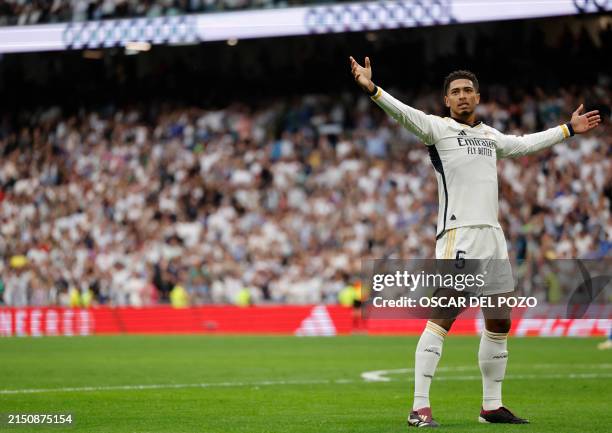 Real Madrid's English midfielder Jude Bellingham celebrates scoring his team's second goal during the Spanish league football match between Real...