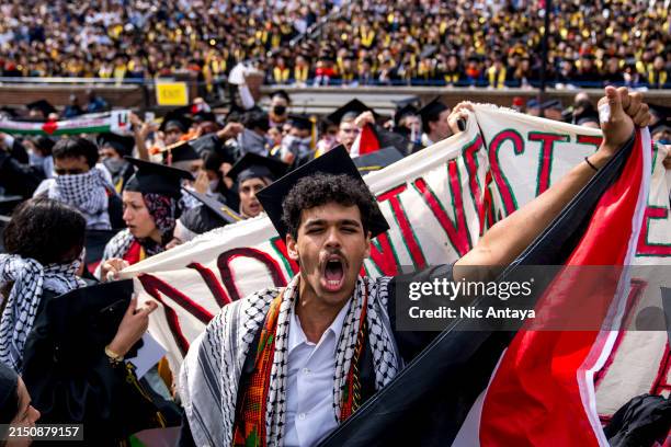 Joseph Fisher chants during a Pro-Palestinian protest during the University of Michigan's spring commencement ceremony on May 4, 2024 at Michigan...