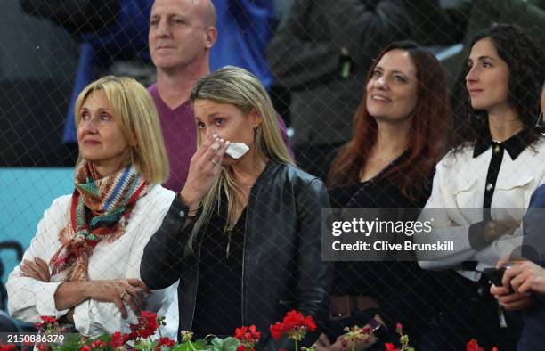 Rafael Nadal's mother Ana Maria Parera , sister Maria Isabel Nadal , and wife Maria Francisca Perello show their dejection as they listen to his...