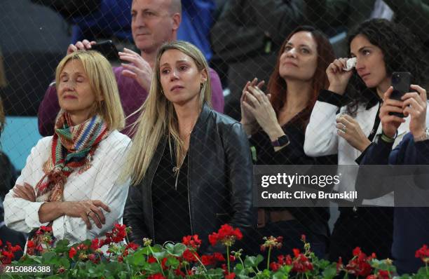 Rafael Nadal's mother Ana Maria Parera , sister Maria Isabel Nadal , and wife Maria Francisca Perello show their dejection as they listen to his...