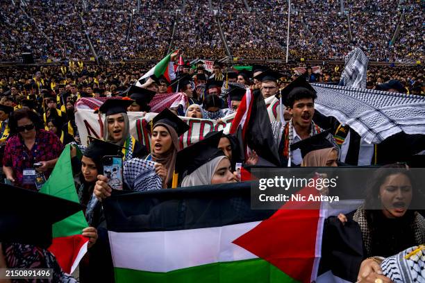 Students demonstate during a Pro-Palestinian protest during the University of Michigan's spring commencement ceremony on May 4, 2024 at Michigan...
