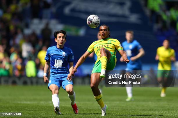 Sam McCallum of Norwich City and Koji Miyoshi of Birmingham are in action during the Sky Bet Championship match between Birmingham City and Norwich...