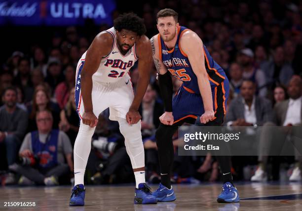 Joel Embiid of the Philadelphia 76ers and Isaiah Hartenstein of the New York Knicks line up next to each other during the second half at Madison...