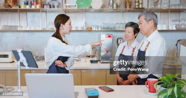 young manager scold elderly staffs - overworked waitress stock pictures, royalty-free photos & images