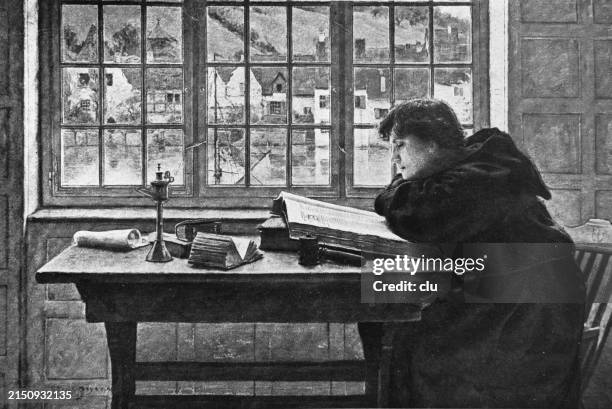 young monk studying a large book sitting at a table at a large window - study table stock illustrations