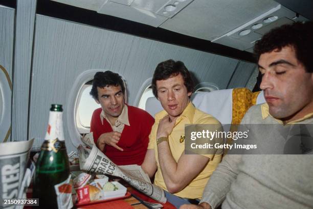 England players Trevor Brooking Trevor Cherry and Peter Shilton chat during plane flight circa March 1980.