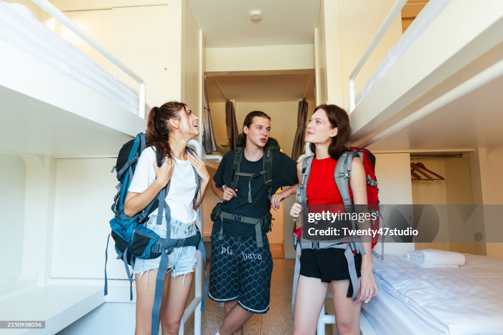Backpackers are sharing in the hostel while traveling