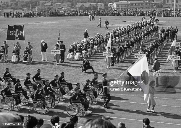 The Japan Paralympic team parade during the opening ceremony of the Summer Paralympics in front of line-ups of teams from Great Britain, Argentine,...
