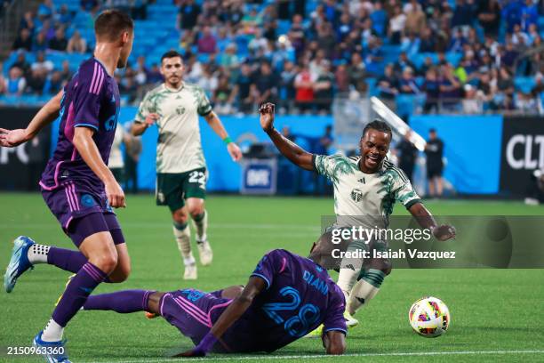 Santiago Moreno of the Portland Timbers loses the ball against Djibril Diani of the Charlotte FC during the first half at Bank of America Stadium on...