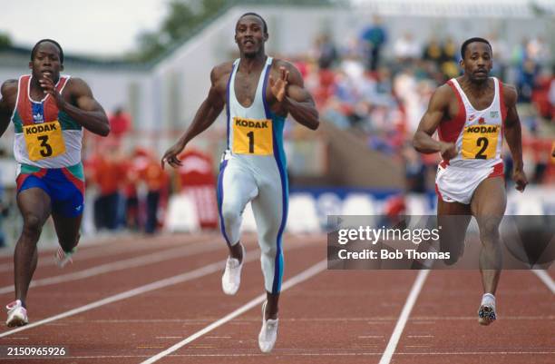 British sprinters, from left, John Regis, Linford Christie and Marcus Adam compete in the Men's 100 metres sprint event on the track at the Kodak...