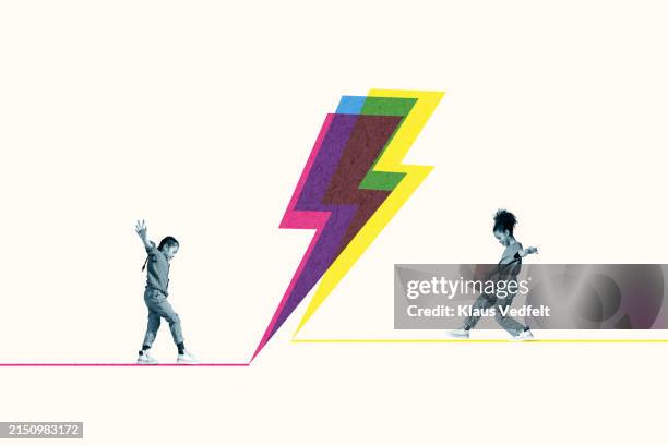 side view of girls balancing on high voltage sign against white background - thunder girls stock pictures, royalty-free photos & images